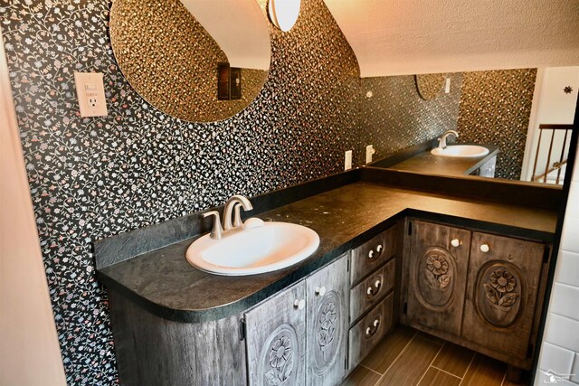 330 Devonshire St, Dearborn, MI 48124 - bathroom with double vanity and a textured ceiling