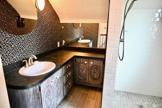 330 Devonshire St, Dearborn, MI 48124 - full bathroom with double vanity, tiled shower, a textured ceiling, and decorative backsplash