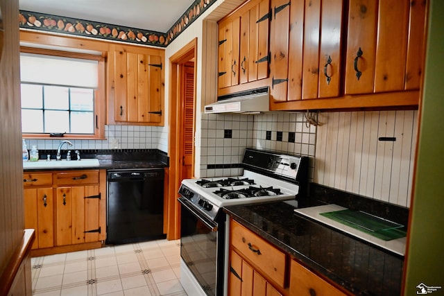 330 Devonshire St, Dearborn, MI 48124 - kitchen with black dishwasher, range with gas cooktop, under cabinet range hood, light floors, and tasteful backsplash