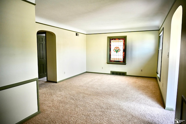 330 Devonshire St, Dearborn, MI 48124 - carpeted spare room featuring arched walkways and baseboards