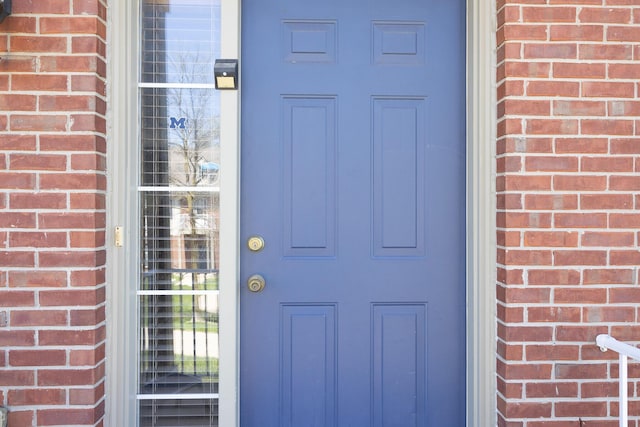 3050 Cloverly Ln, Ann Arbor, MI 48108 - doorway to property featuring brick siding