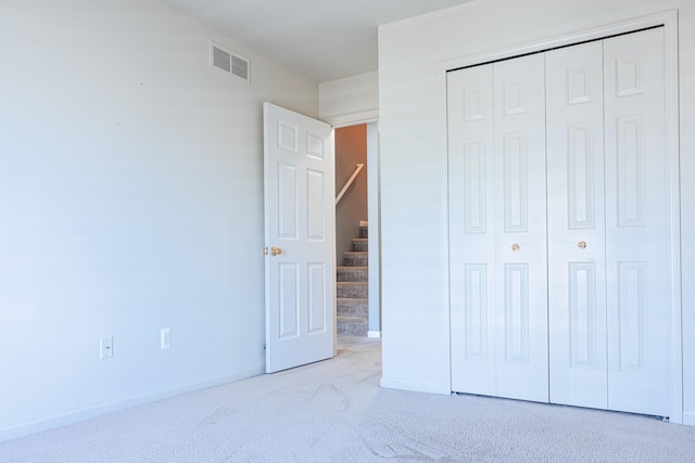 3050 Cloverly Ln, Ann Arbor, MI 48108 - unfurnished bedroom featuring a closet, carpet, and baseboards
