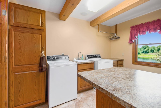 9695 36th St S, Scotts, MI 49088 - laundry area with cabinet space, washing machine and dryer, and light tile patterned floors