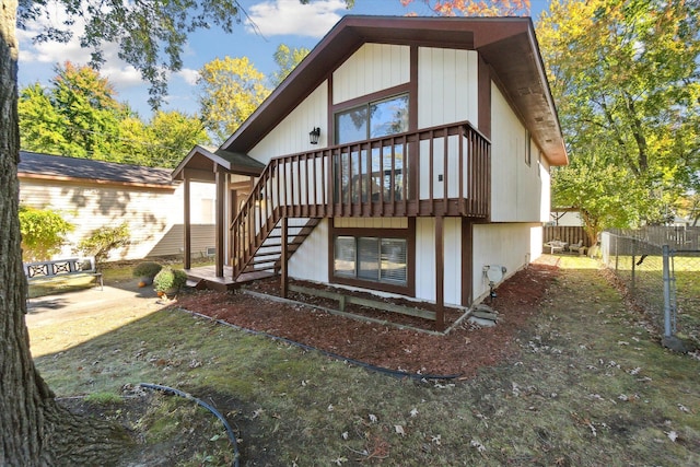 1975 Oldtown Ave, West Bloomfield, MI 48324 - back of house with stairway, fence, and a deck