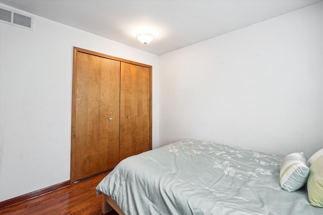 1975 Oldtown Ave, West Bloomfield, MI 48324 - bedroom with dark wood finished floors, a closet, and baseboards