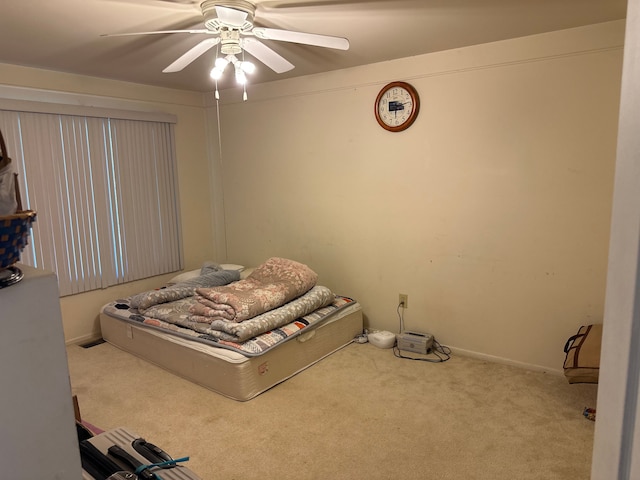carpeted bedroom featuring a ceiling fan
