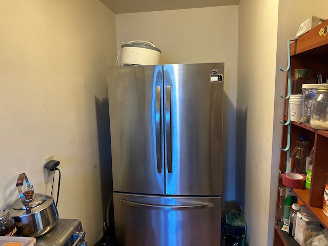 kitchen featuring freestanding refrigerator