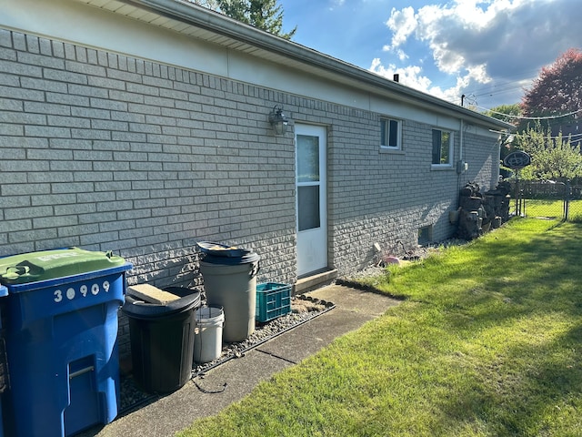 view of side of home featuring brick siding