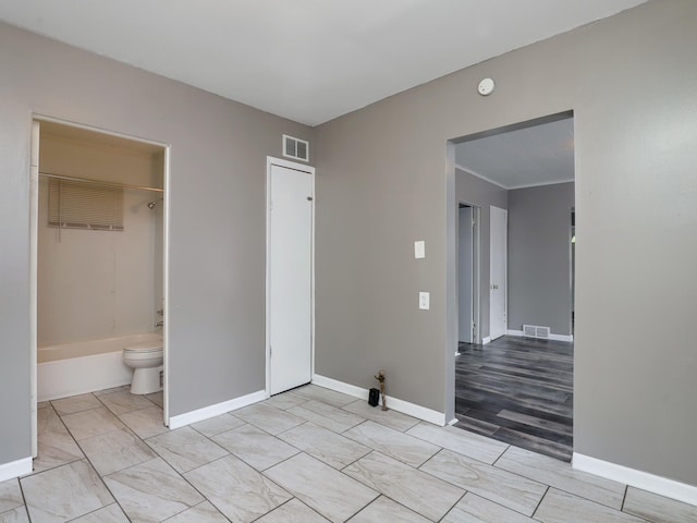 unfurnished bedroom with baseboards