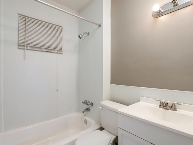bathroom with toilet, vanity, and washtub / shower combination