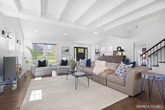 living room with plenty of natural light, stairs, wood finished floors, and recessed lighting