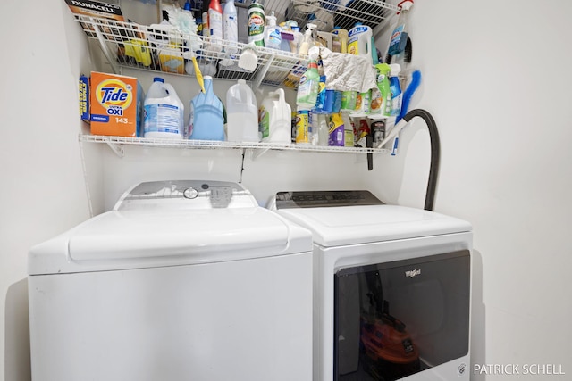 laundry area with washing machine and clothes dryer