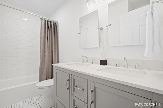 bathroom with toilet, shower / bath combo, double vanity, and tile patterned floors