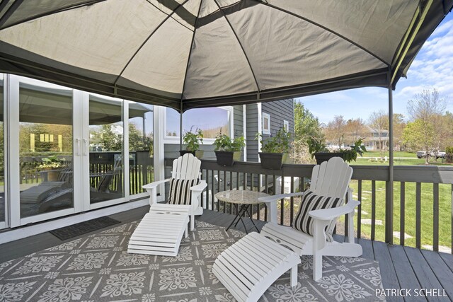sunroom / solarium featuring french doors