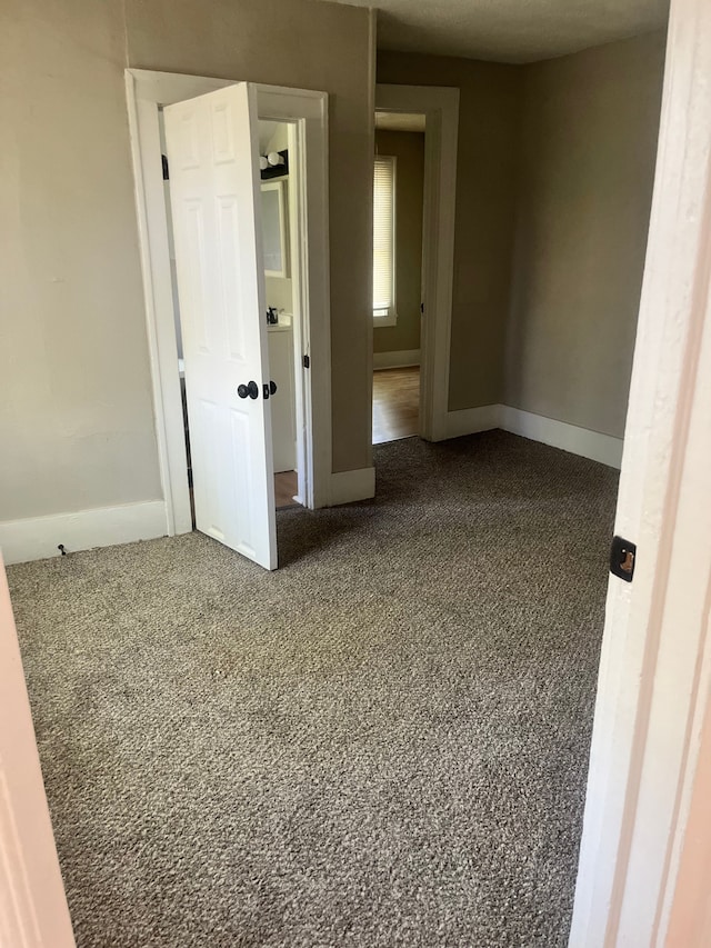 27305 Norfolk St, Inkster, MI 48141 - unfurnished room featuring dark colored carpet and baseboards