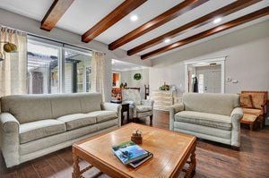 living room with wood finished floors and recessed lighting