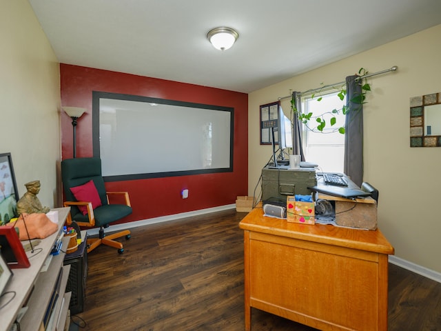 office with dark wood-type flooring and baseboards