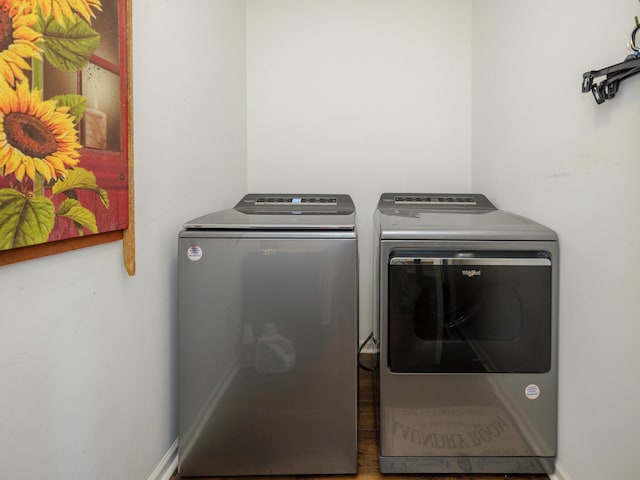 laundry room featuring washing machine and clothes dryer