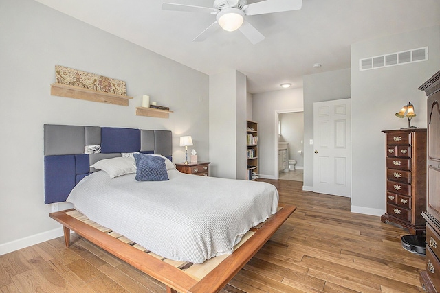 bedroom featuring wood finished floors, baseboards, and a ceiling fan