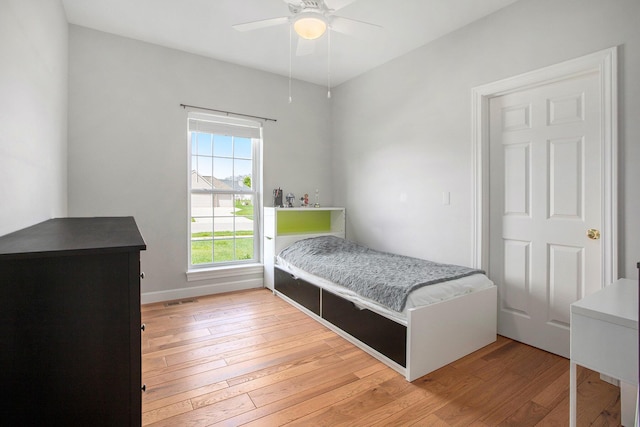 bedroom featuring light wood-style flooring and ceiling fan
