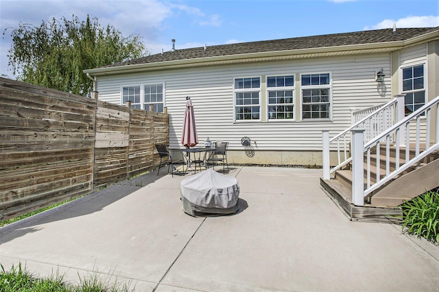 view of patio featuring fence
