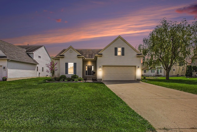 traditional home with an attached garage, driveway, and a front lawn