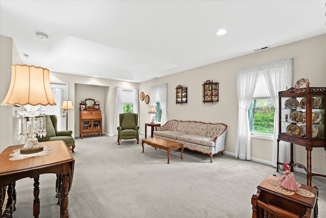 living area featuring carpet floors, baseboards, and recessed lighting