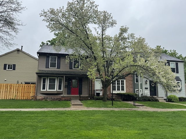 view of front of house featuring roof with shingles and covered porch