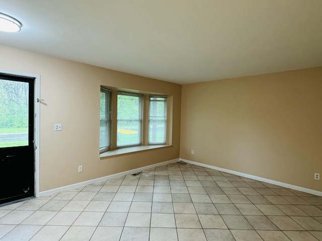 empty room with baseboards