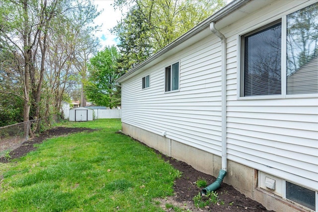 view of side of home with a storage unit and an outdoor structure