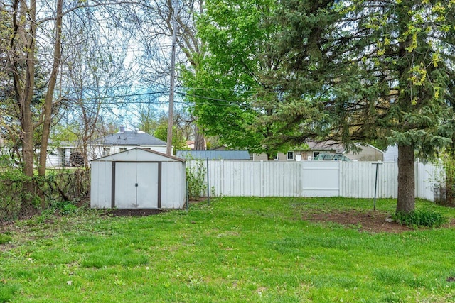 view of yard featuring a storage unit and an outbuilding