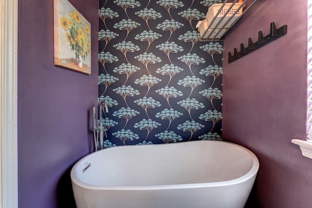 full bathroom featuring a freestanding bath