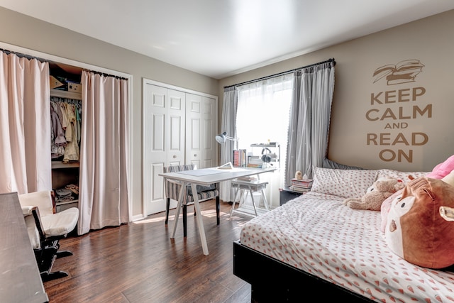 bedroom featuring dark wood-style floors