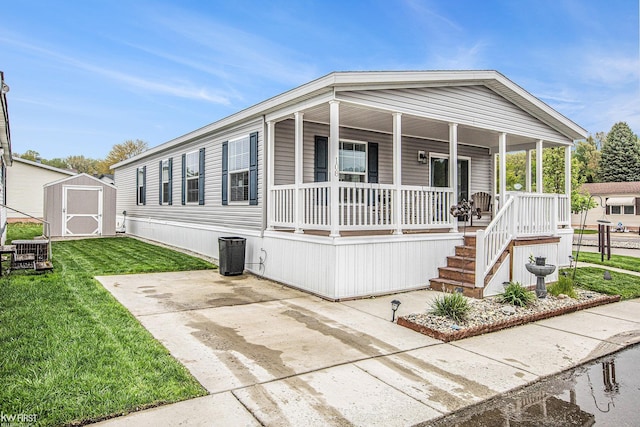 39500 Warren Rd, Canton, MI 48187 - manufactured / mobile home with covered porch, a storage unit, and a front lawn