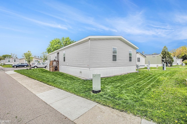 39500 Warren Rd, Canton, MI 48187 - view of side of property with a yard