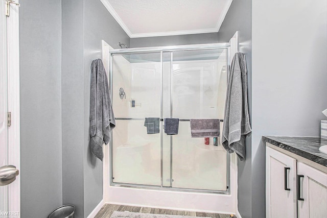 39500 Warren Rd, Canton, MI 48187 - full bath featuring crown molding, vanity, a shower stall, and wood finished floors