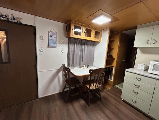 dining area with dark wood finished floors