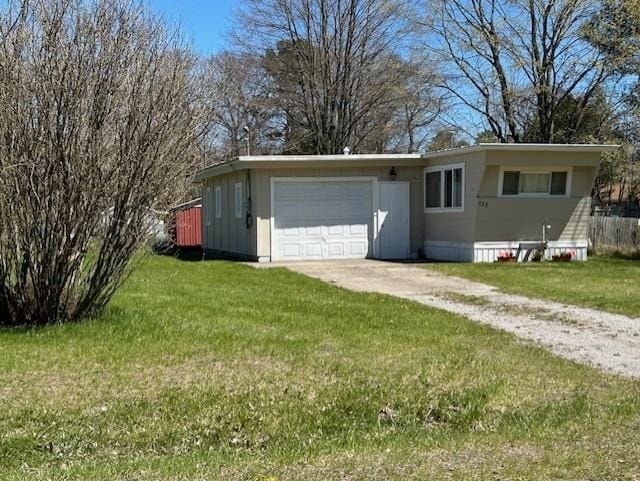 garage featuring concrete driveway