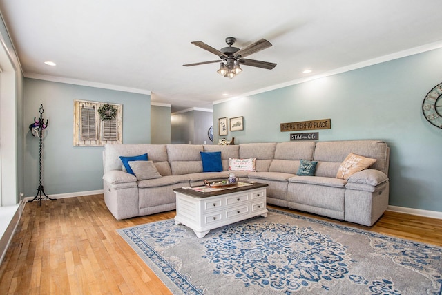 living room with baseboards, a ceiling fan, ornamental molding, light wood finished floors, and recessed lighting