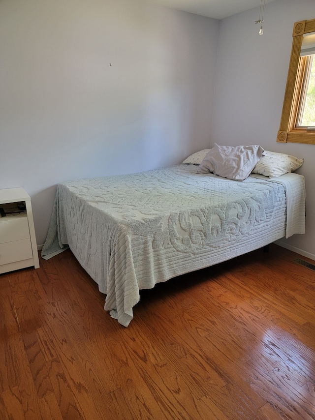 bedroom with wood finished floors