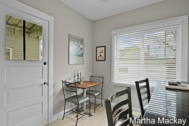 625 Leonard St NE, Grand Rapids, MI 49503 - dining area with baseboards, light wood-type flooring, and an office area
