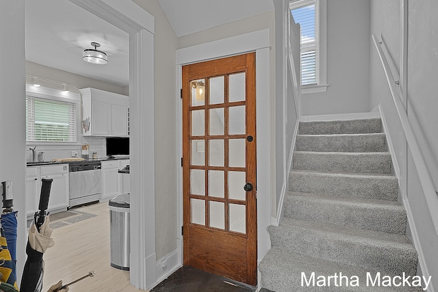 625 Leonard St NE, Grand Rapids, MI 49503 - staircase with baseboards and plenty of natural light