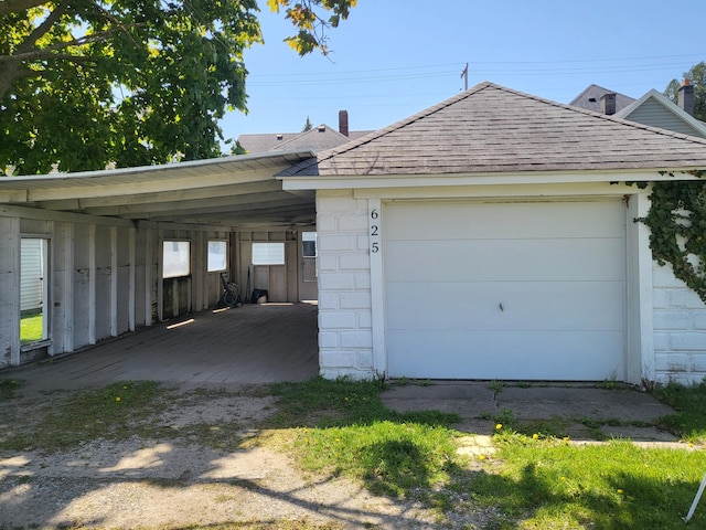 625 Leonard St NE, Grand Rapids, MI 49503 - garage with an attached carport and driveway