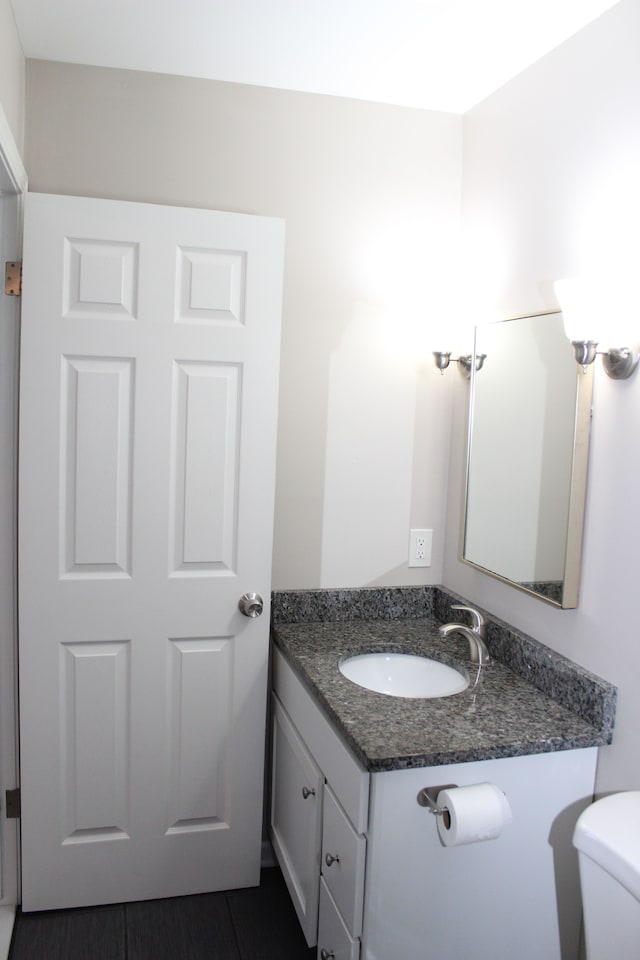 bathroom with vanity and toilet