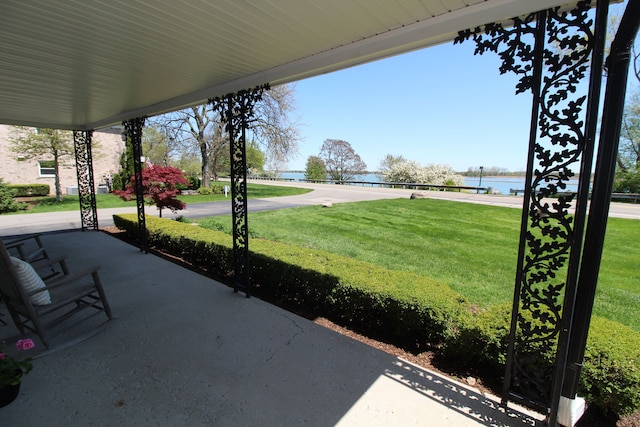 view of patio featuring a water view