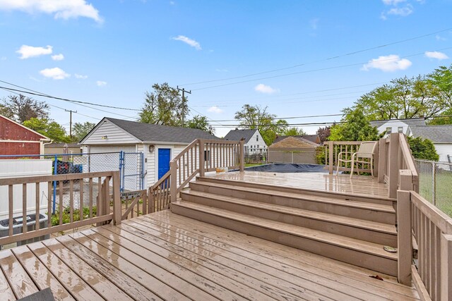 18310 Harman St, Melvindale, MI 48122 - wooden deck with fence and an outbuilding