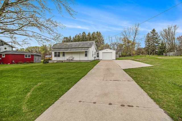 185 S Madison Ave, Custer, MI 49405 - view of front of property featuring a porch, driveway, a front yard, and a garage