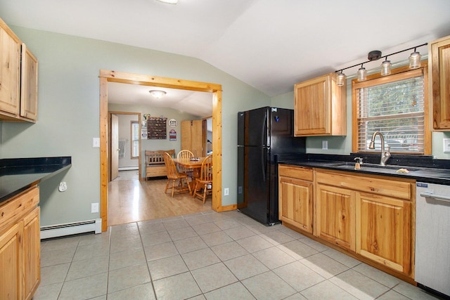 185 S Madison Ave, Custer, MI 49405 - kitchen with vaulted ceiling, freestanding refrigerator, dishwasher, a sink, and a baseboard radiator