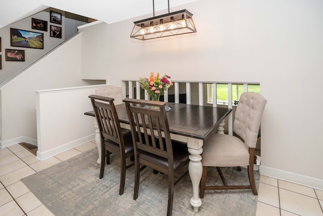 dining area featuring tile patterned floors and baseboards