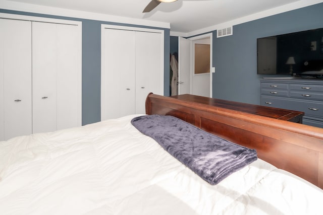 bedroom featuring two closets and a ceiling fan
